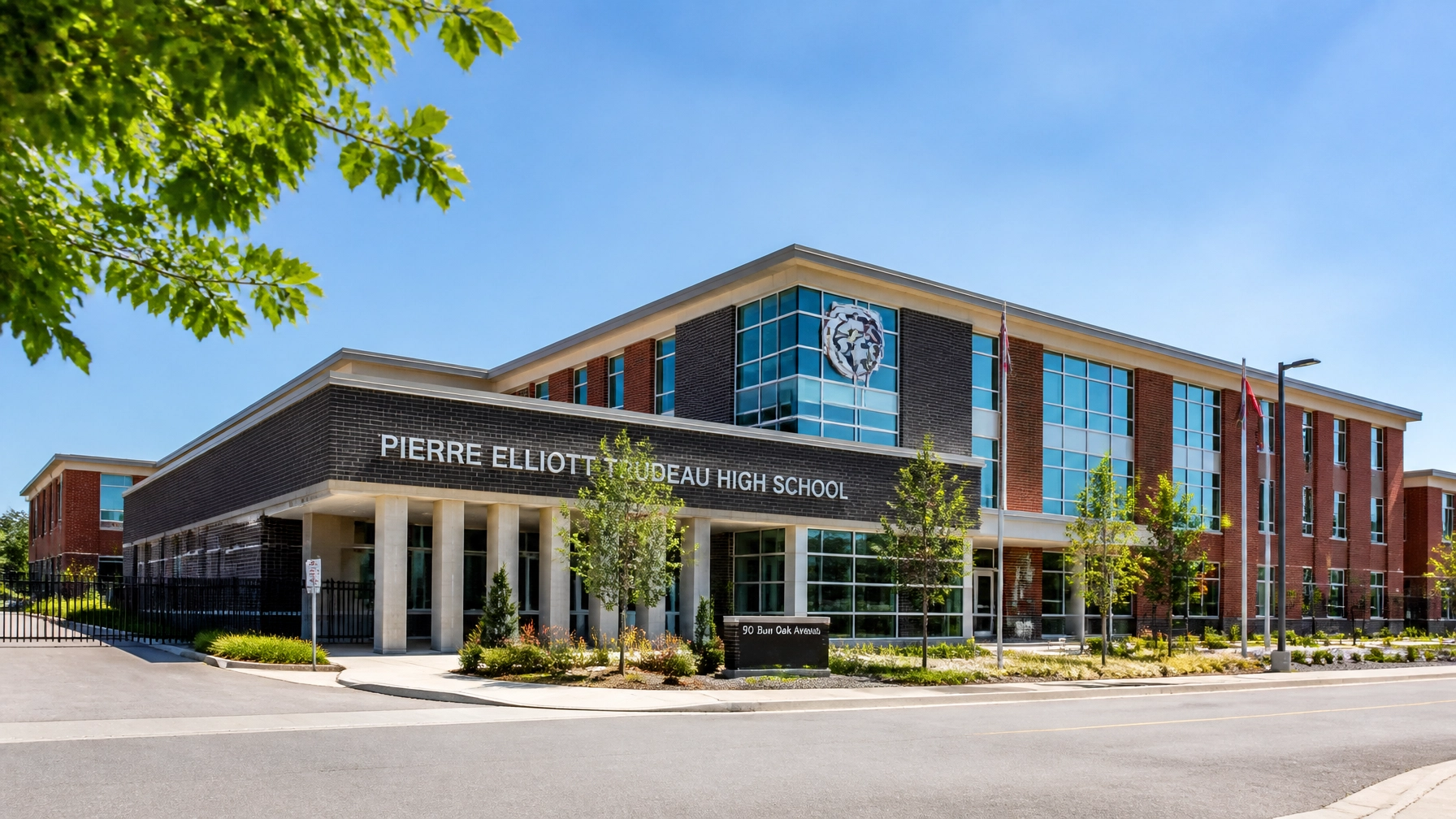 A wide shot of a prestigious school building in a high-end Ontario neighbourhood, illustrating the importance of school districts.