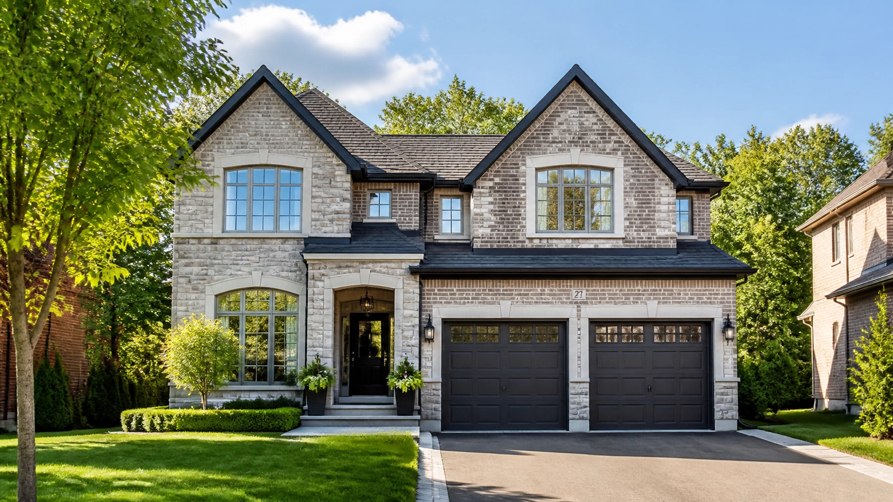 A modern, two-story detached home in an Ontario suburb, stone and brick architecture, natural morning light, professional real estate photography.