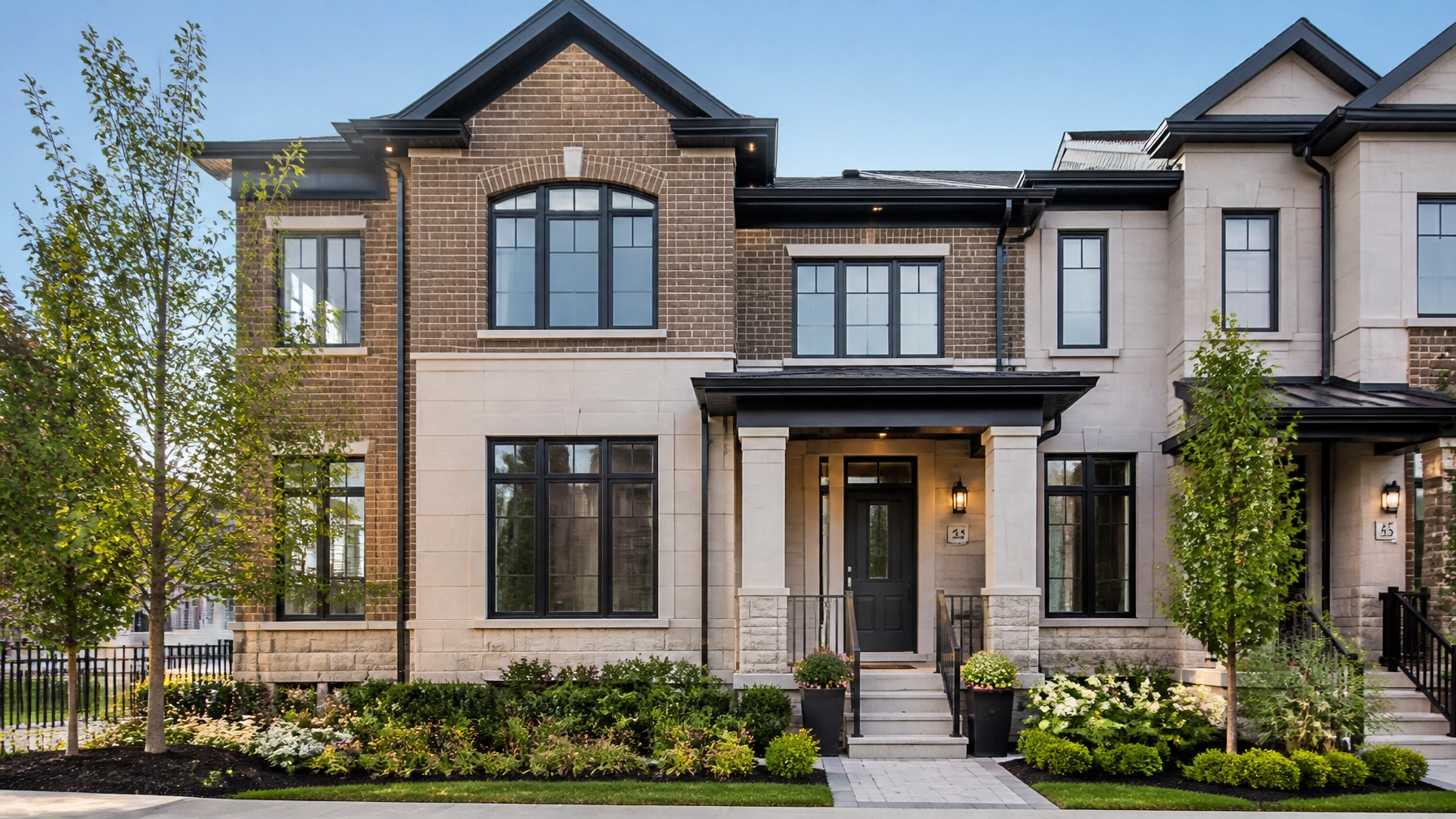 A professional exterior photograph of a stylish modern townhouse in Aurora, Ontario, symbolizing the structured and orderly nature of the current housing market.