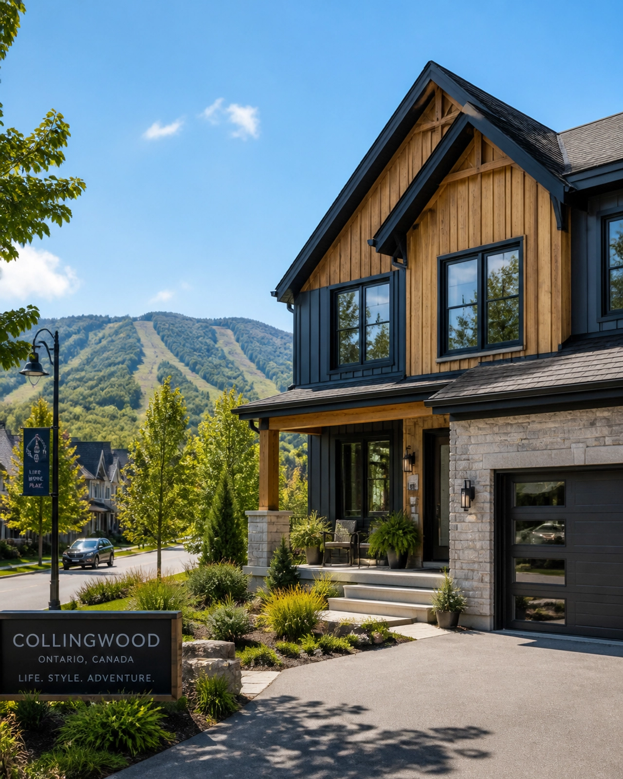 A scenic residential view in Collingwood, Ontario, showcasing a modern home with wood accents near tree-lined streets with the Blue Mountains in the distance.